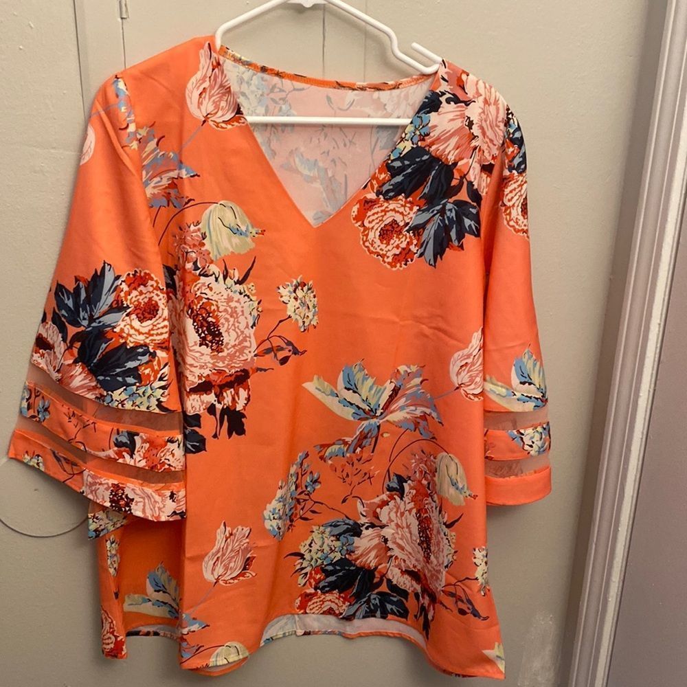 Amazon coral floral top Amazon coral floral top with flowy sleeves. Bust